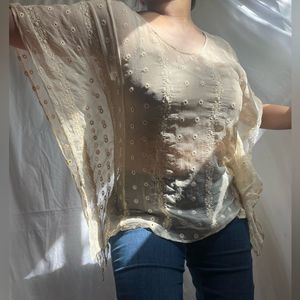 Medium/large 100% silk sheer cream eyelet top with batwing sleeves.
